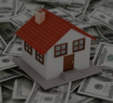 A house on a mound of money, showcasing wealth and luxury. Perfect for a real estate agency