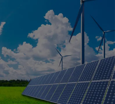 Renewable energy sources: solar panels and wind turbines in a field
