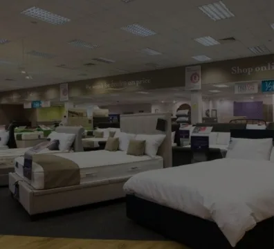 A spacious room with multiple beds and mattresses