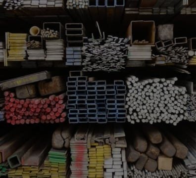 A heap of metal pipes and materials, commonly used in construction, at a building supply store
