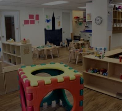A colorful playroom filled with toys and furniture for children to enjoy and have fun
