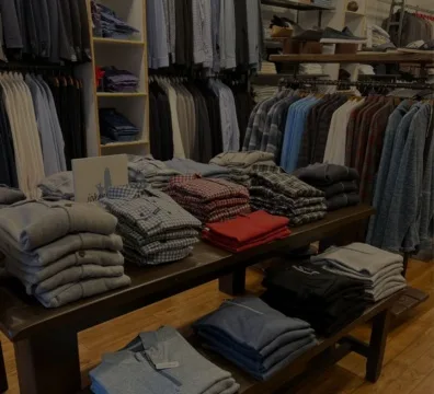 Shirts and ties neatly arranged on a table in a clothing store