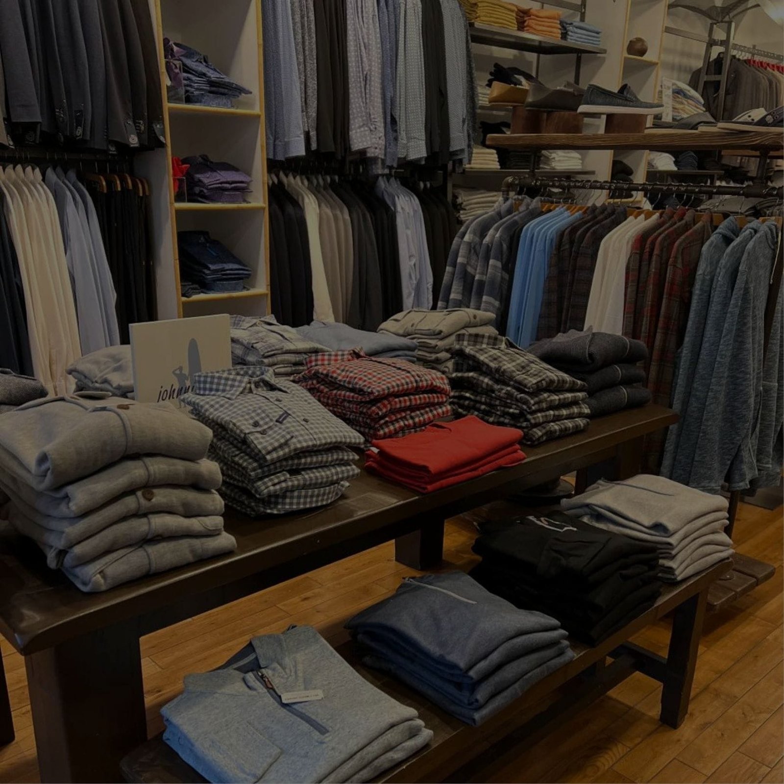 Shirts and ties neatly arranged on a table in a clothing store