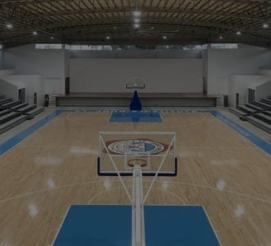 A basketball court inside a large building