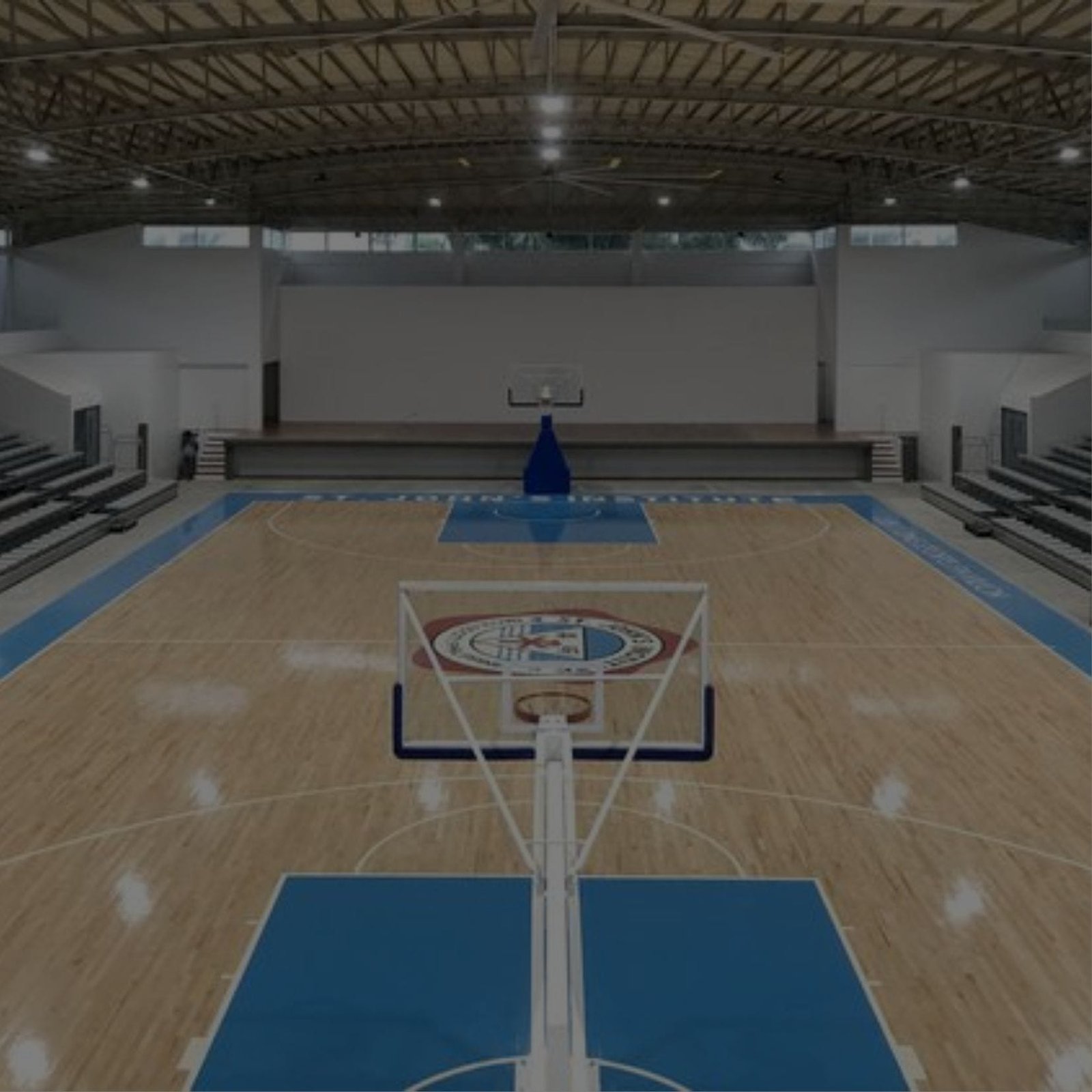 A basketball court inside a large building