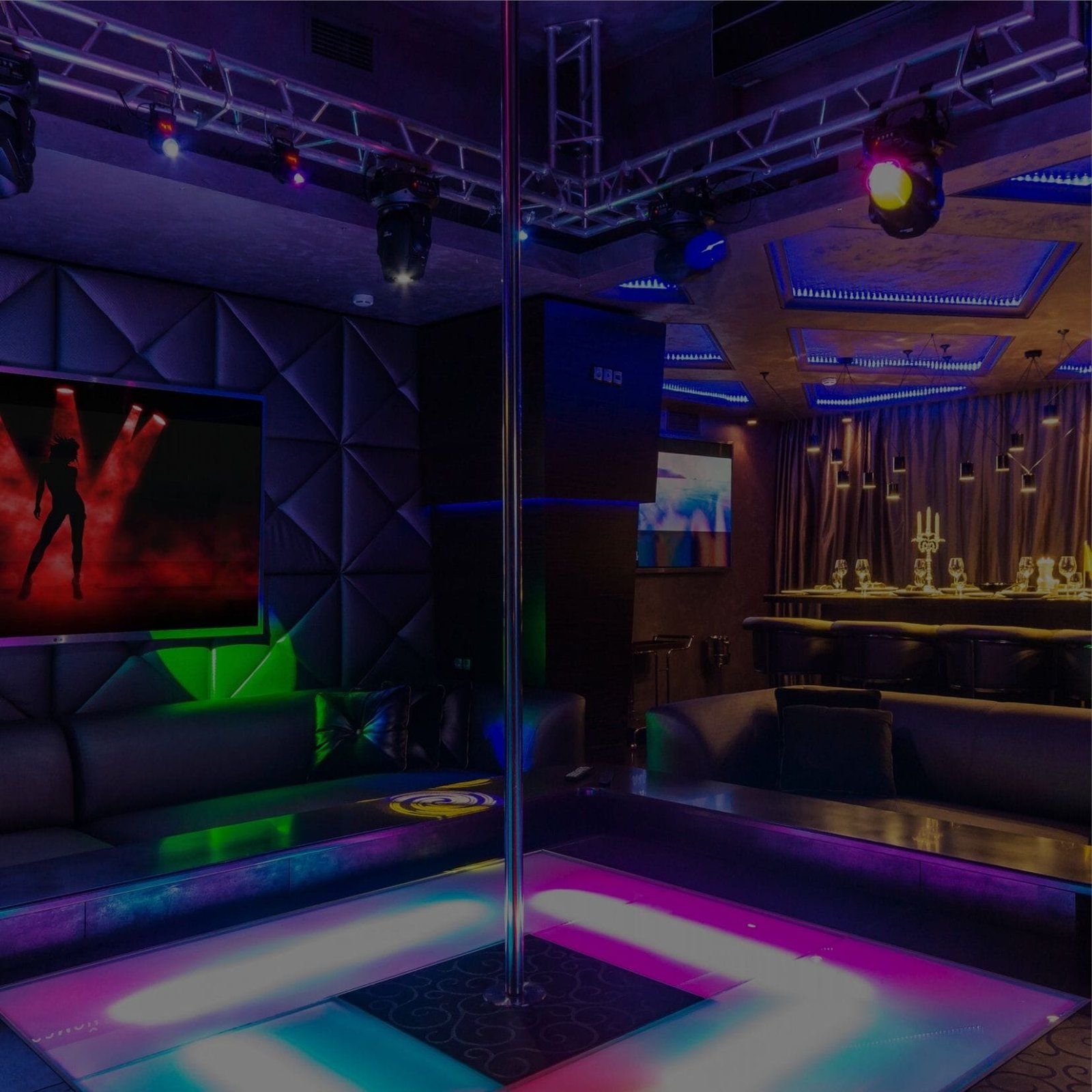 A nightclub with a pole and a TV