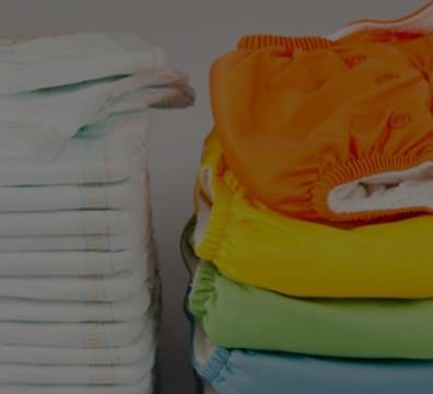 A stack of diapers with the words "diaper care" on them. Perfect for your diaper service needs