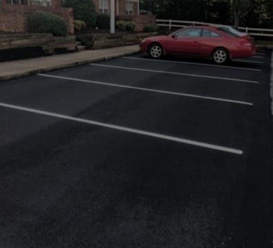 Two cars parked in a Free Parking lot
