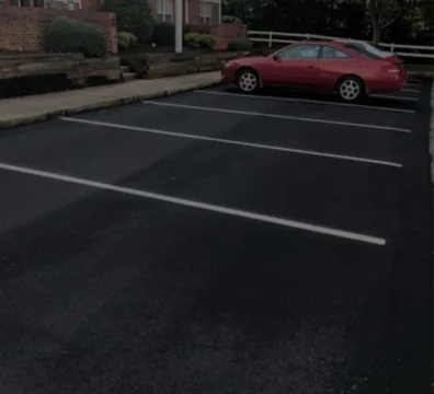Two cars parked in a Free Parking lot