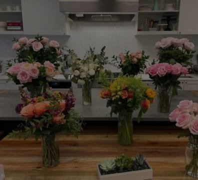 colorful vases of flowers in a flower shop