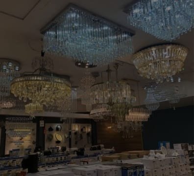 A store filled with beautiful chandeliers and lights.