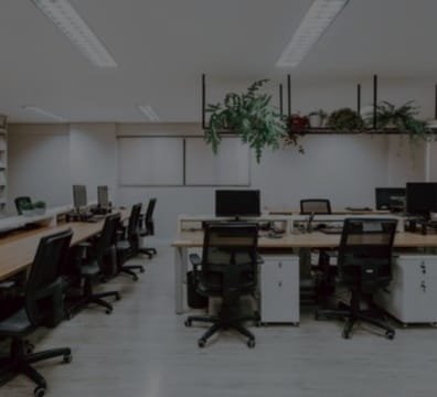 A professional workspace designed for a media company, complete with desks and chairs