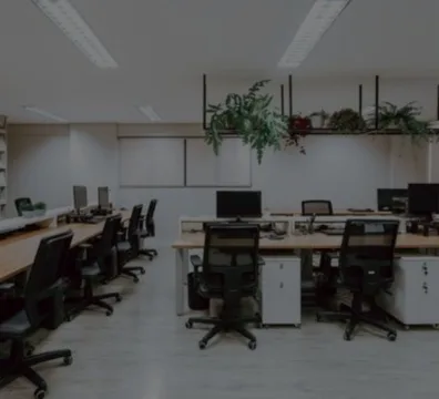 A professional workspace designed for a media company, complete with desks and chairs