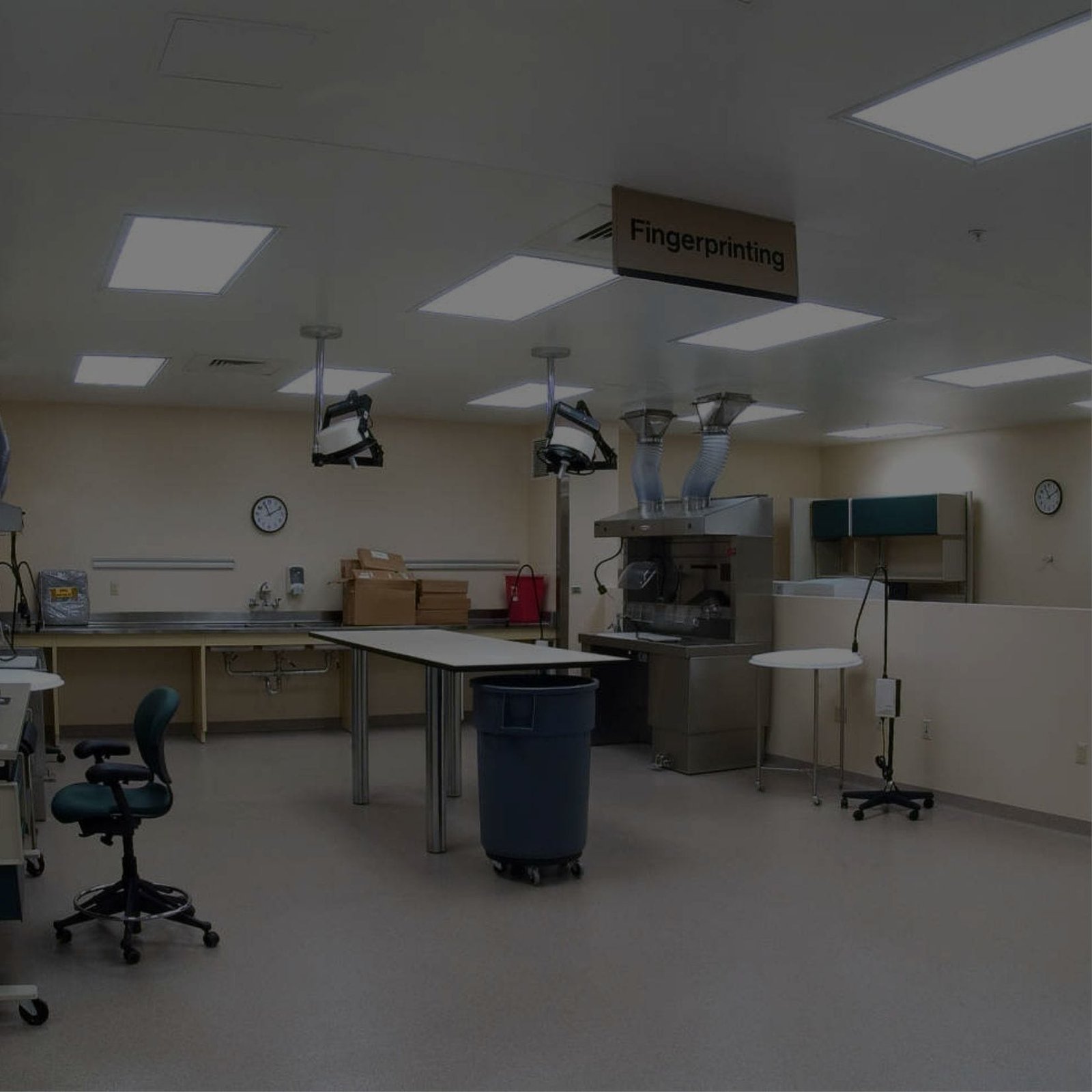 A mortuary service space featuring a desk and chairs in a large room