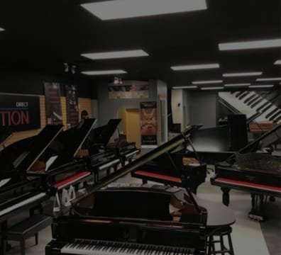 Piano Store a filled with numerous pianos and musical instruments