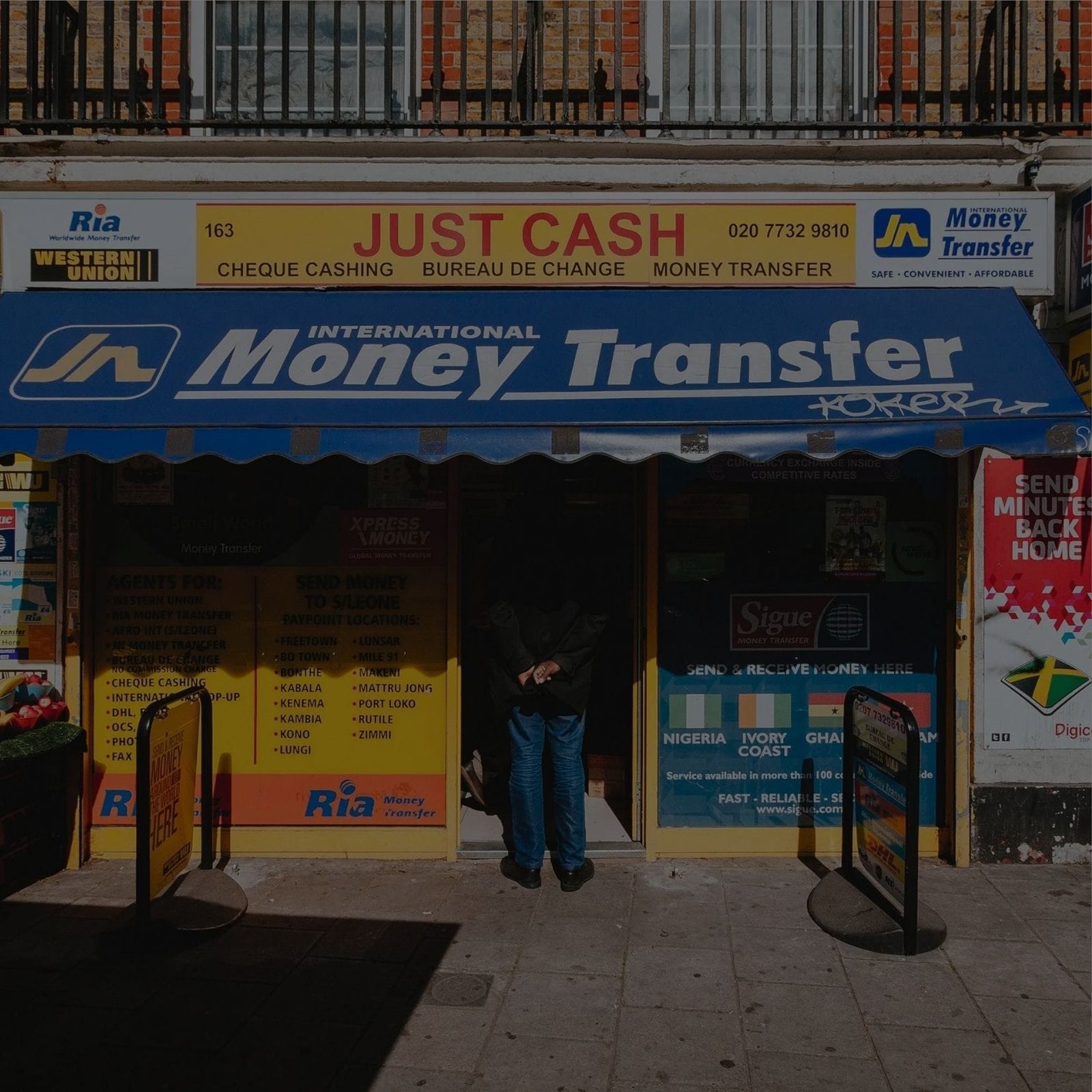 A person holding cash and a smartphone, Money Transfer Service to another person using a mobile app