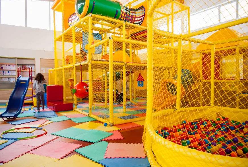 A vibrant yellow play structure designed for children's outdoor fun and activities.